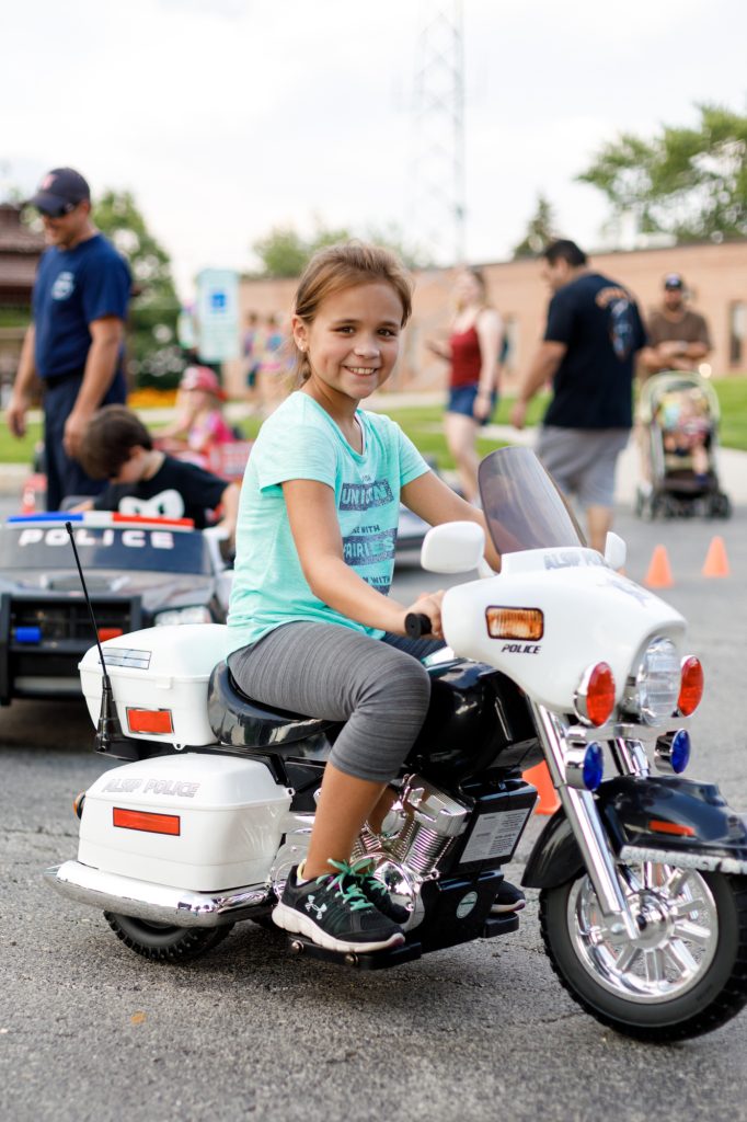 Young girl on replica police motorcycle